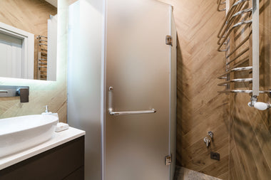 Dreamwerks neo angle shower door with frosted glass in a modern bathroom.