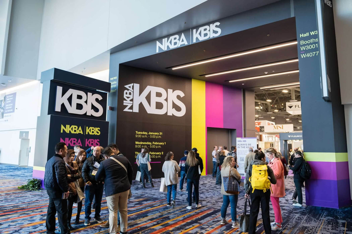 Attendees entering the NKBA KBIS trade show exhibition hall entrance.