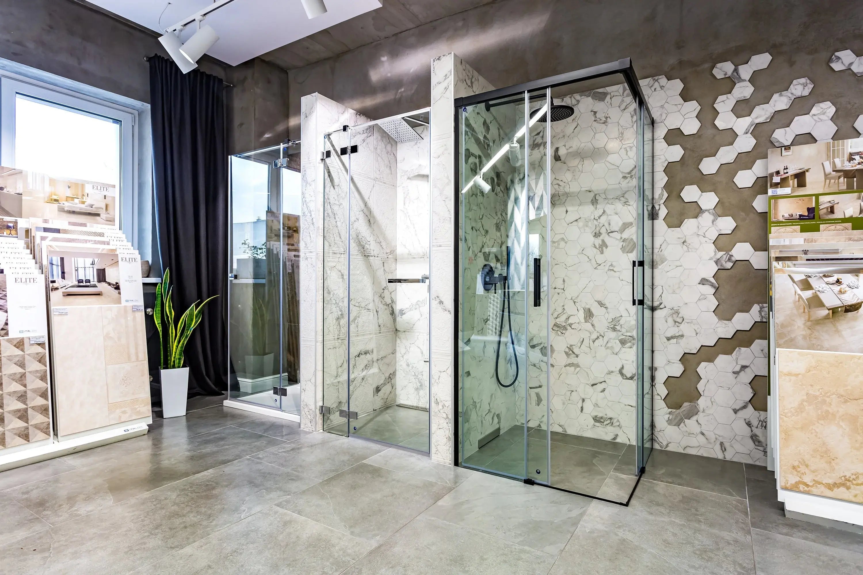 New shower enclosure kits that are next to each other in a nice showroom.
