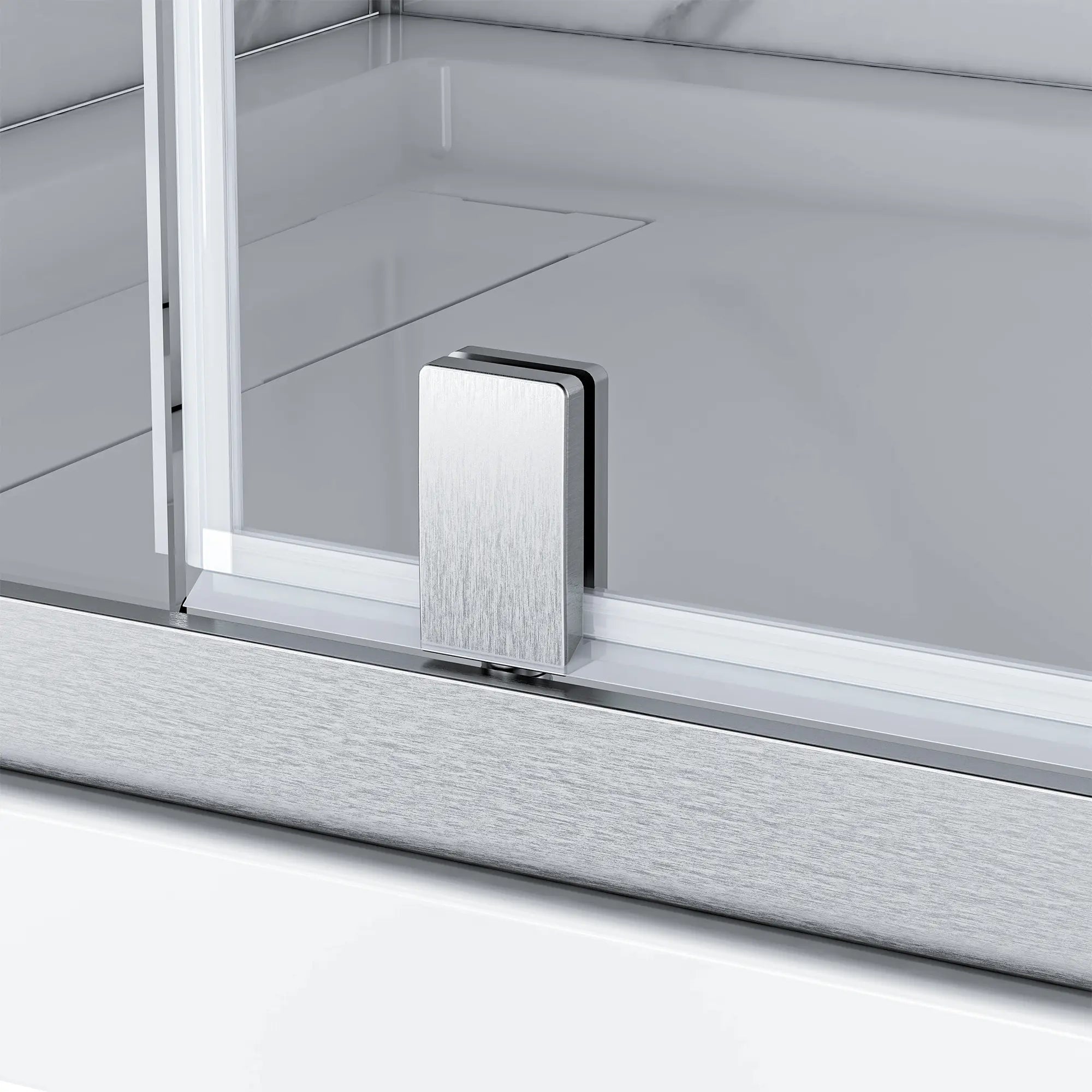 Close-up of a metallic handle on a glass shower enclosure