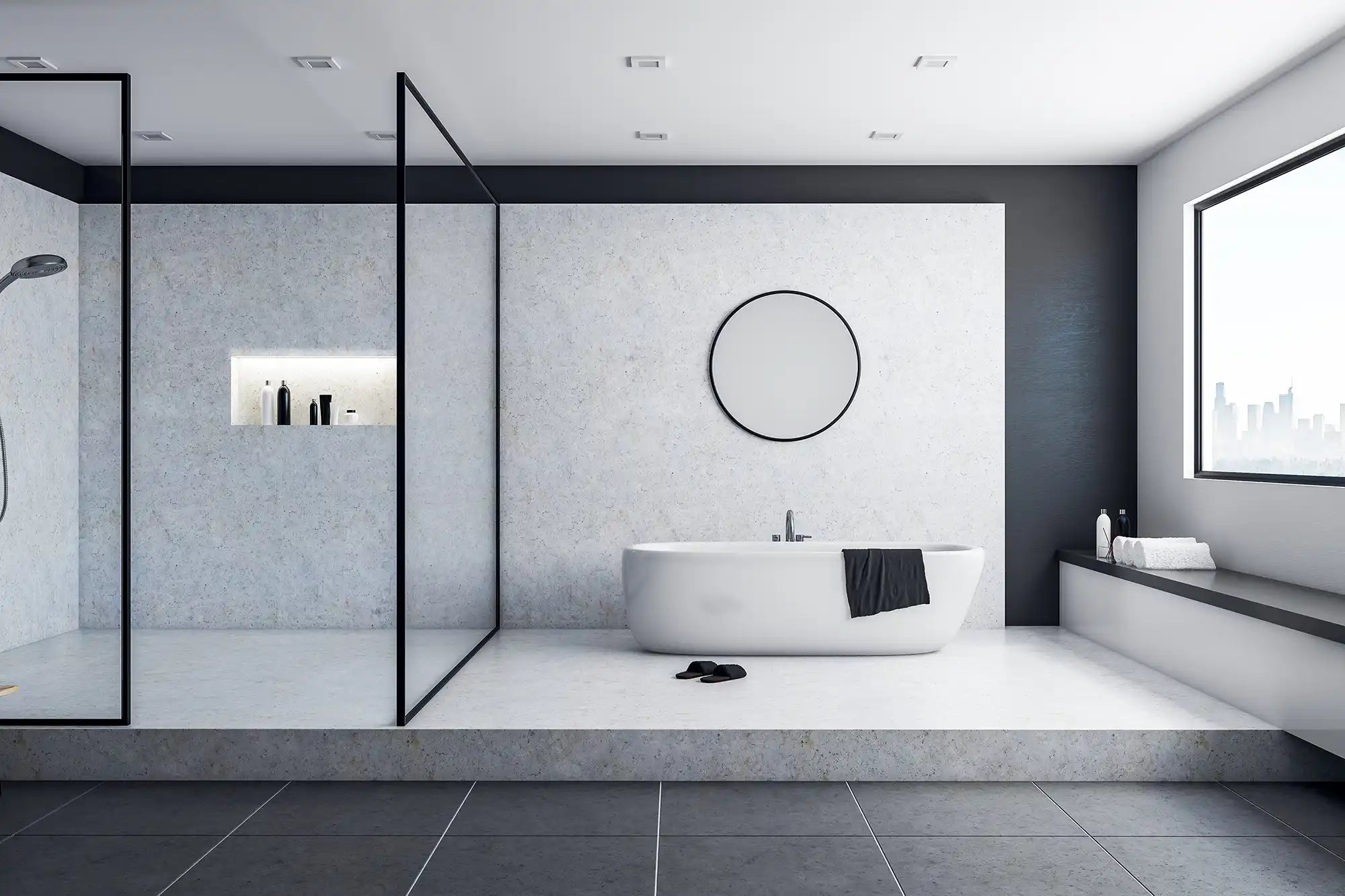 Modern luxury bathroom featuring a white freestanding bathtub on a raised platform, a large walk-in shower with black-framed glass, and white stone walls with a circular mirror.
