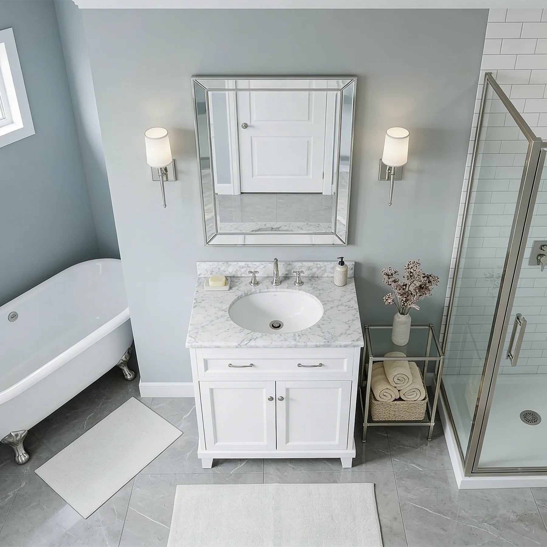 Bathroom with white vanity, marble countertop, and shower area.
