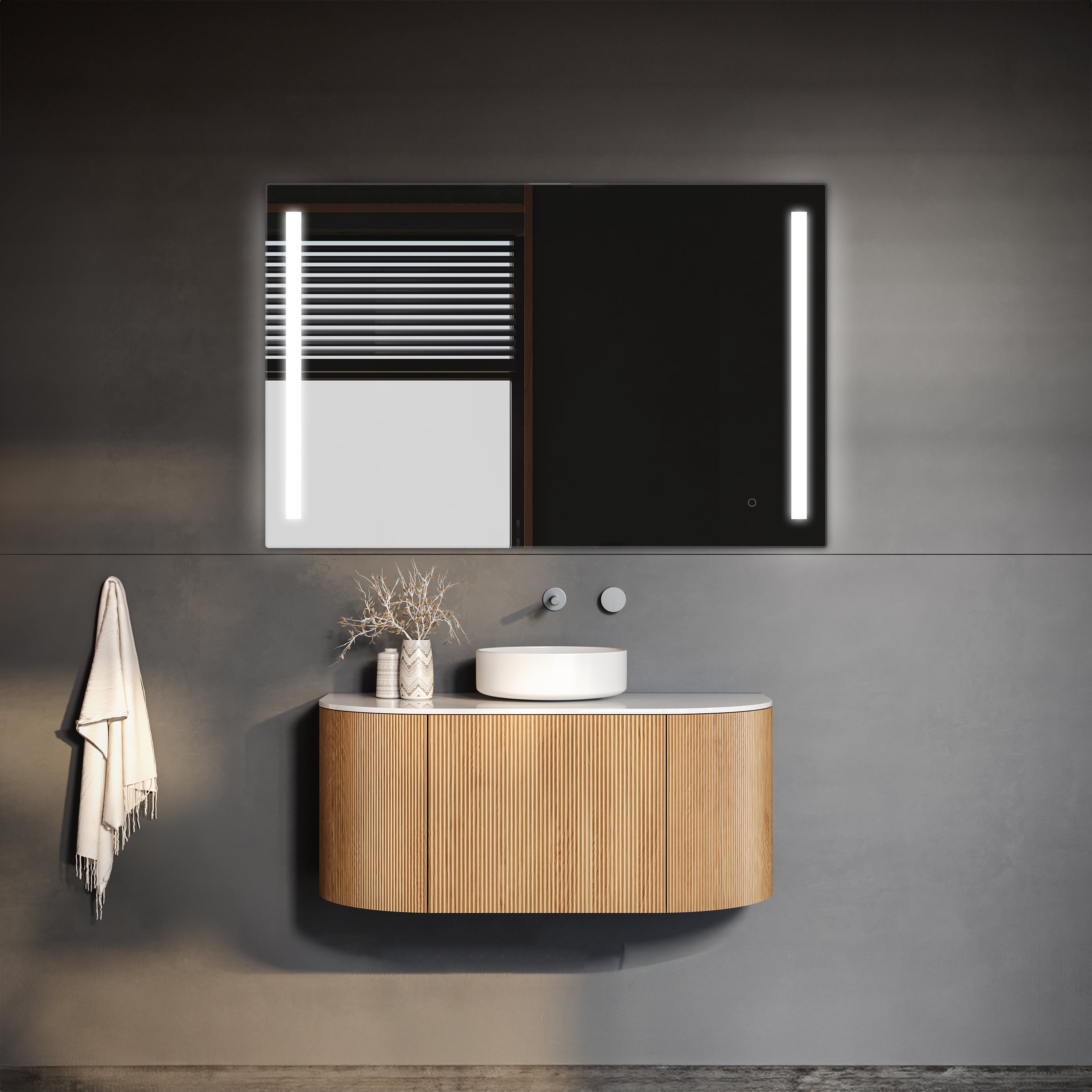 Modern minimalistic bathroom vanity with elegant curved wooden design, featuring a sleek washbasin and a stylishly lit TREVISO LED Mirror with an integrated defogger, all set against a sophisticated dark