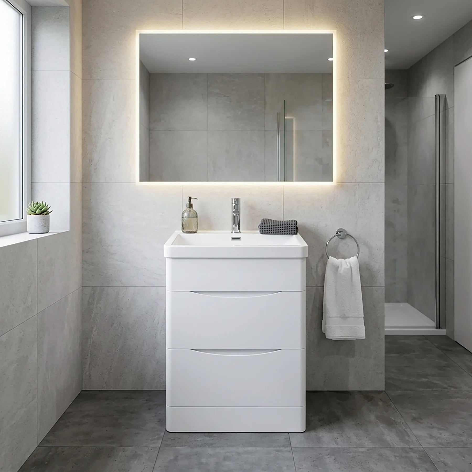 Modern bathroom with a white vanity unit, sink, and illuminated mirror.