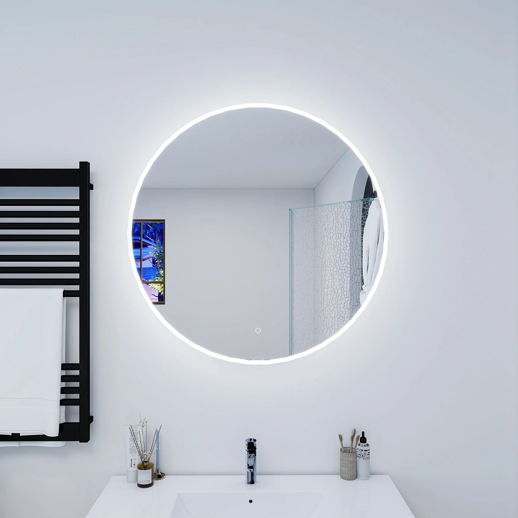 Bathroom with a round illuminated mirror, black towel rack, and white sink.
