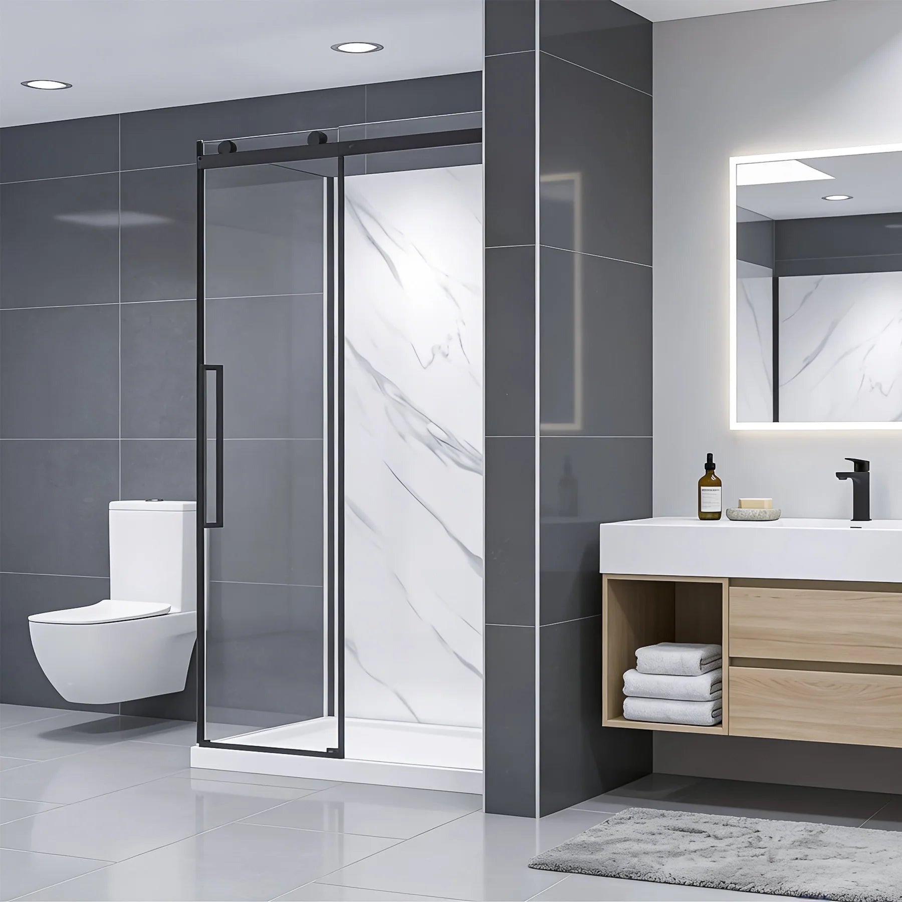 Modern bathroom with shower enclosure, sink, and toilet.
