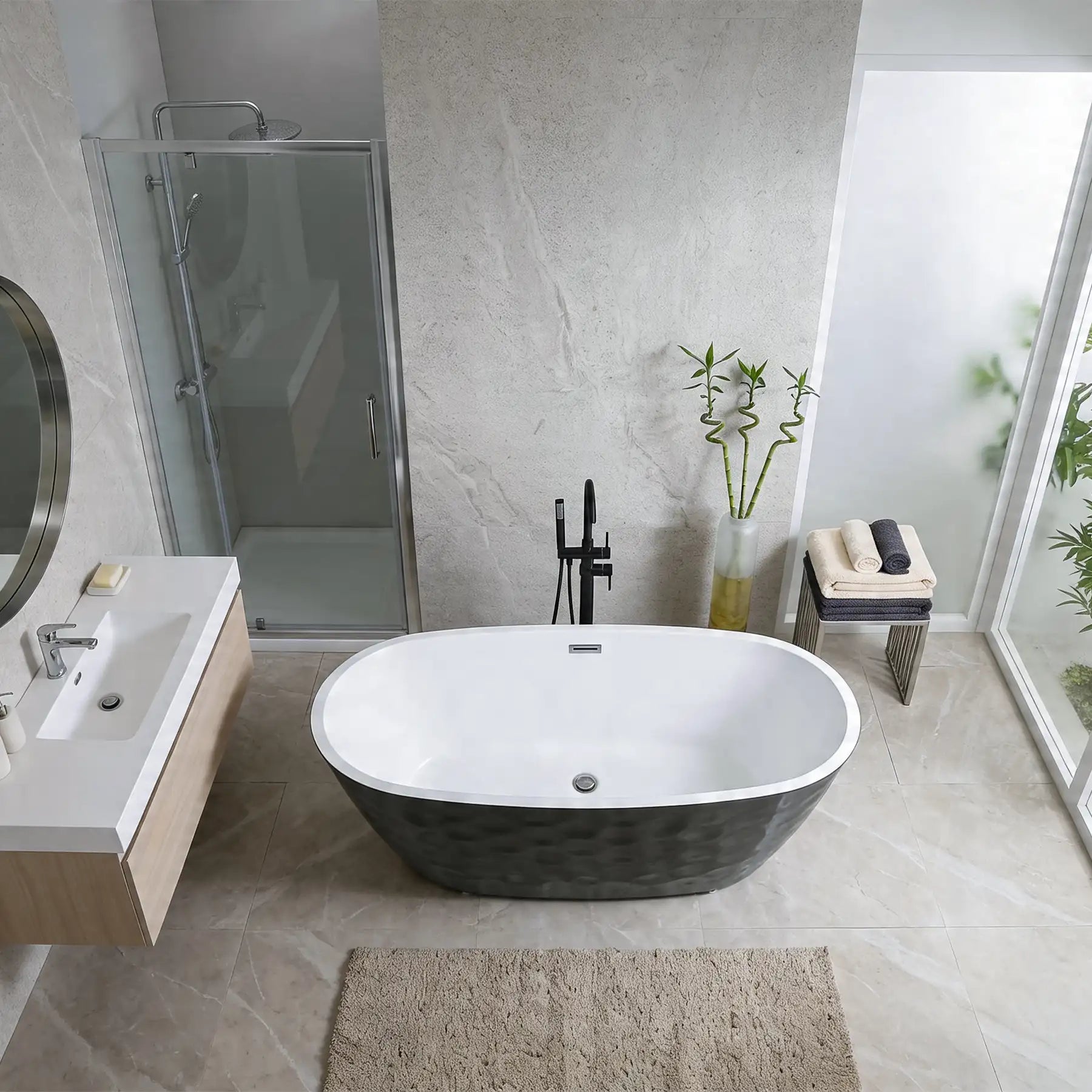 Modern bathroom with freestanding bathtub, sink, and shower area.