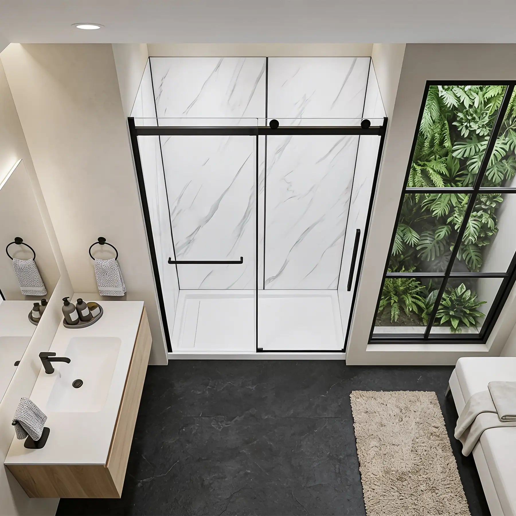 Modern bathroom with shower enclosure and view of greenery outside