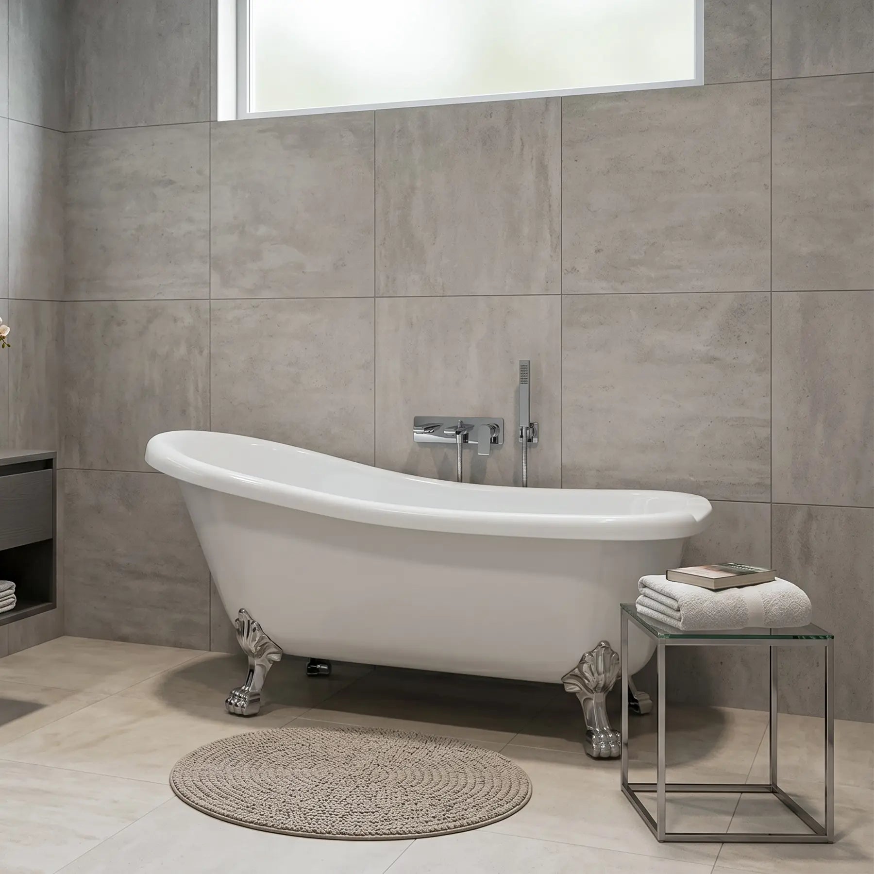 Modern bathroom with a freestanding bathtub, tiled walls, and a small table with towels.