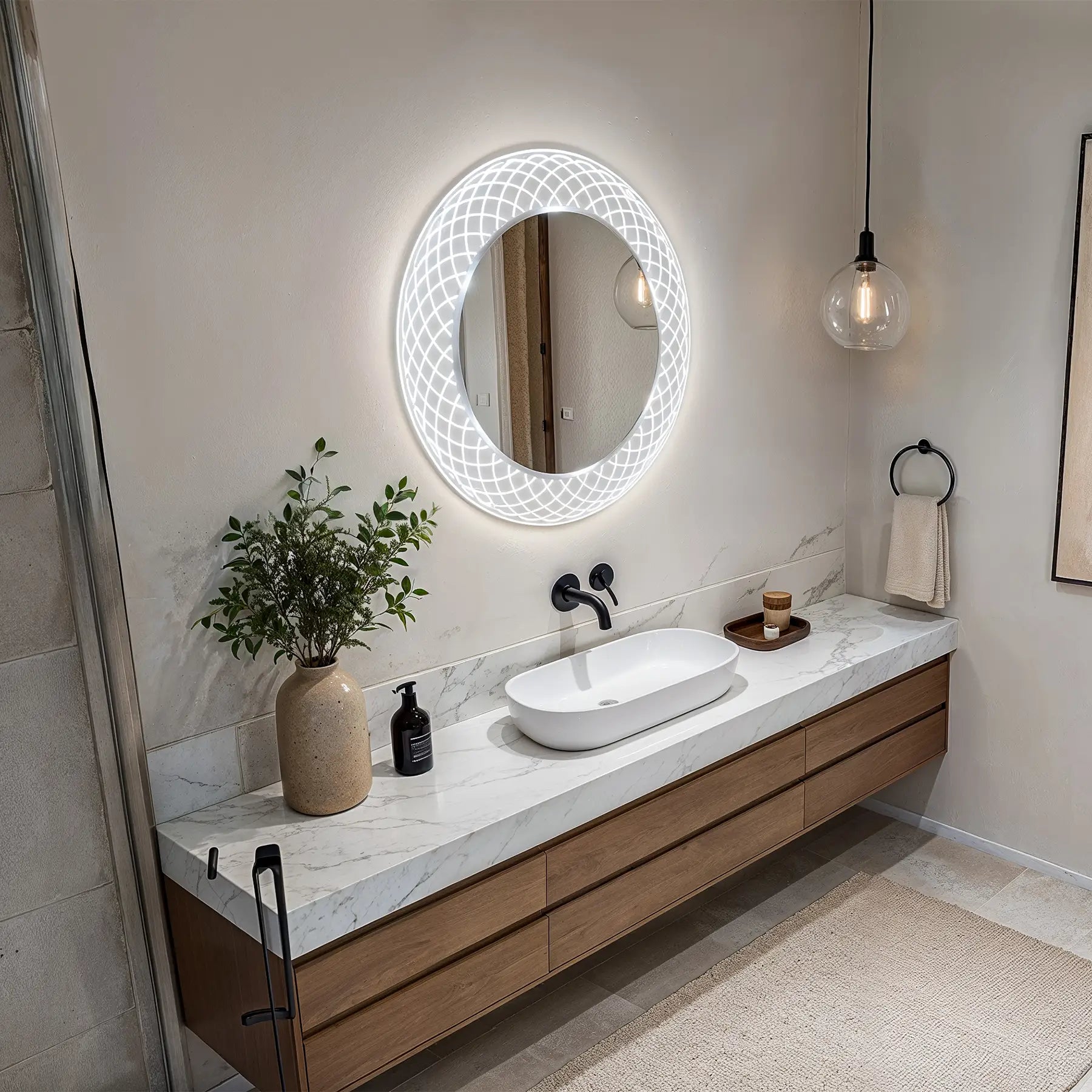Modern bathroom vanity with round illuminated mirror, sink, and decorative elements.