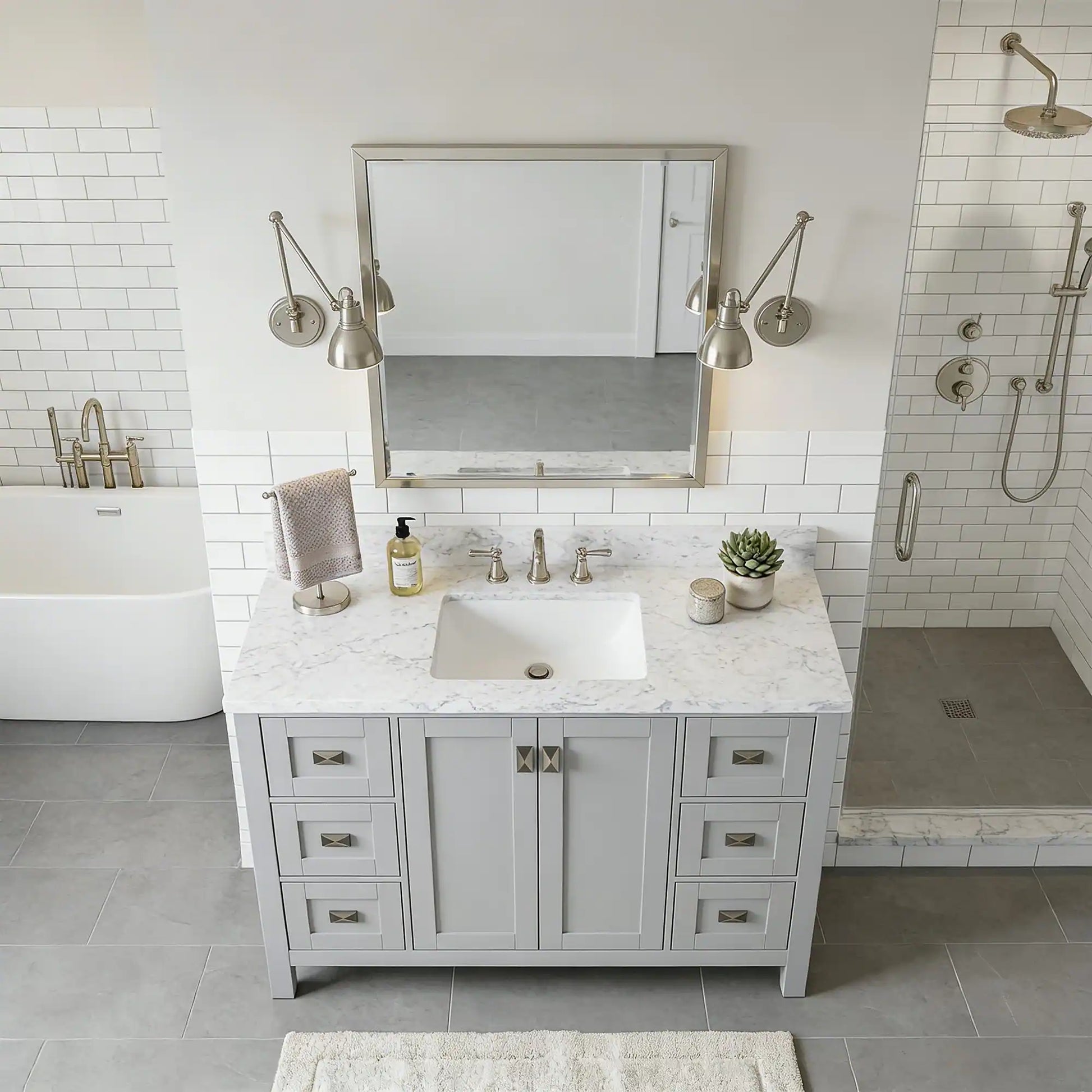 Bathroom with marble vanity, sink, and mirror in a modern setting.