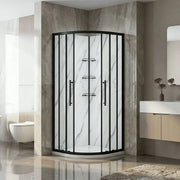 Corner shower enclosure in a modern bathroom with marble walls and a sink.