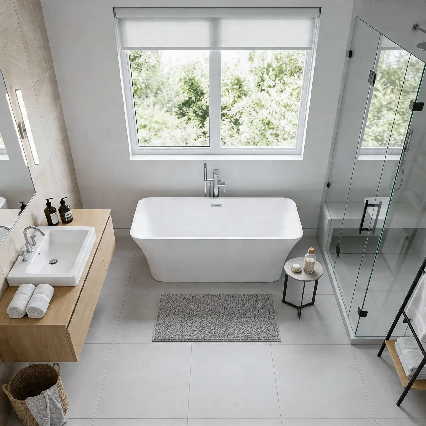 Modern bathroom with a freestanding bathtub, sink, and shower area.