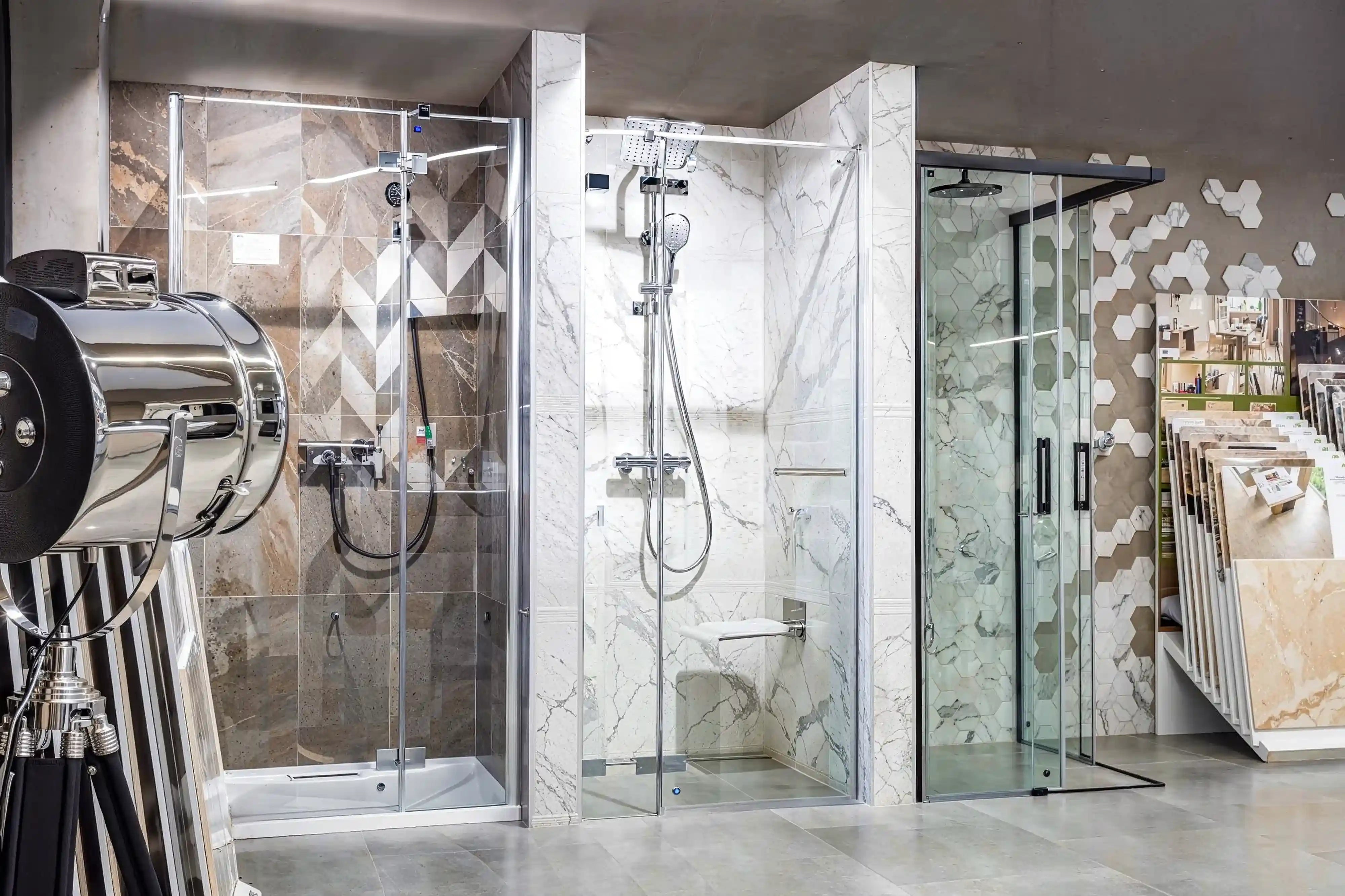 Modern shower kits with glass doors in a showroom setting