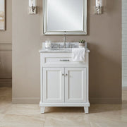 Bathroom vanity with sink and mirror in a neutral-colored bathroom.