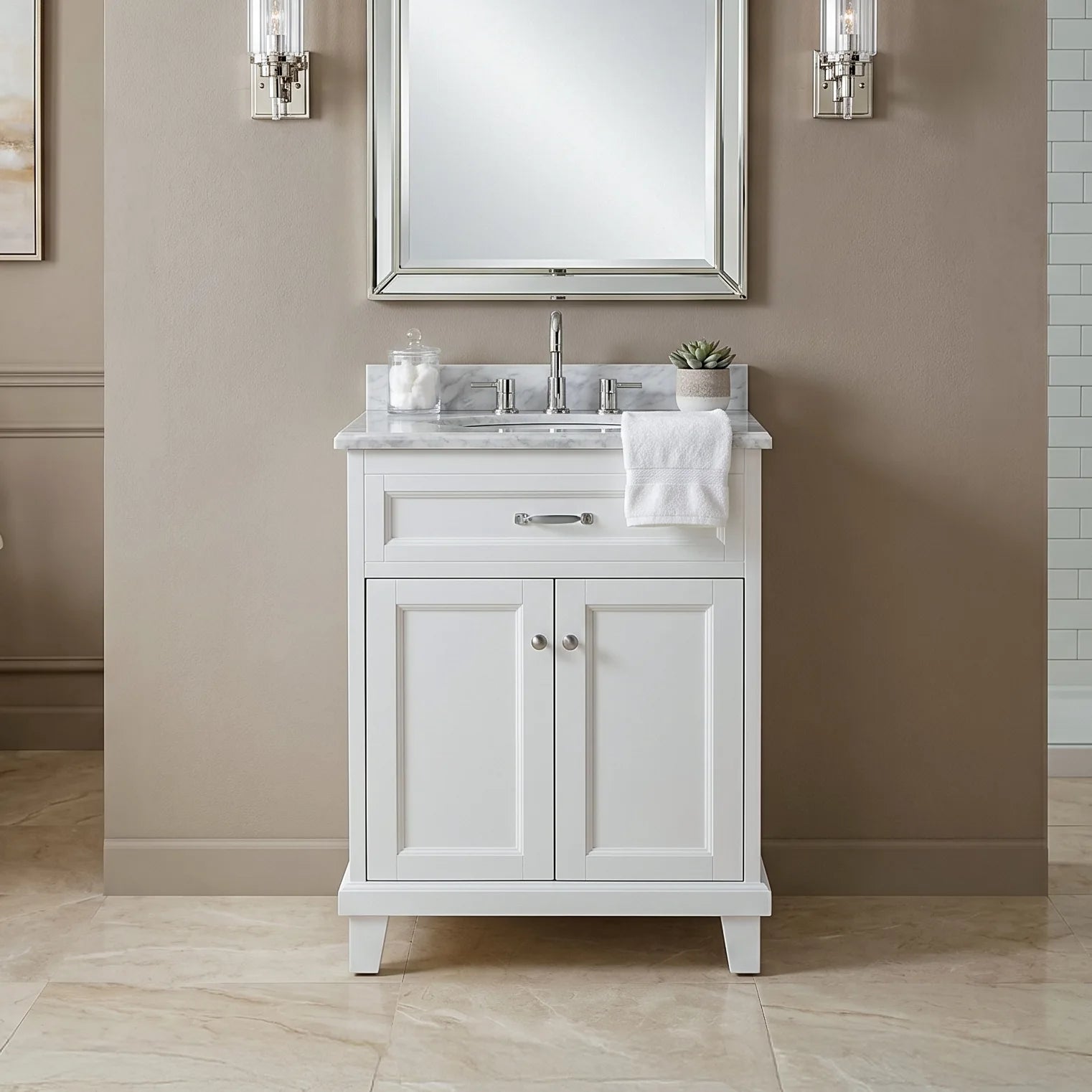 Bathroom vanity with sink and mirror in a neutral-colored bathroom.