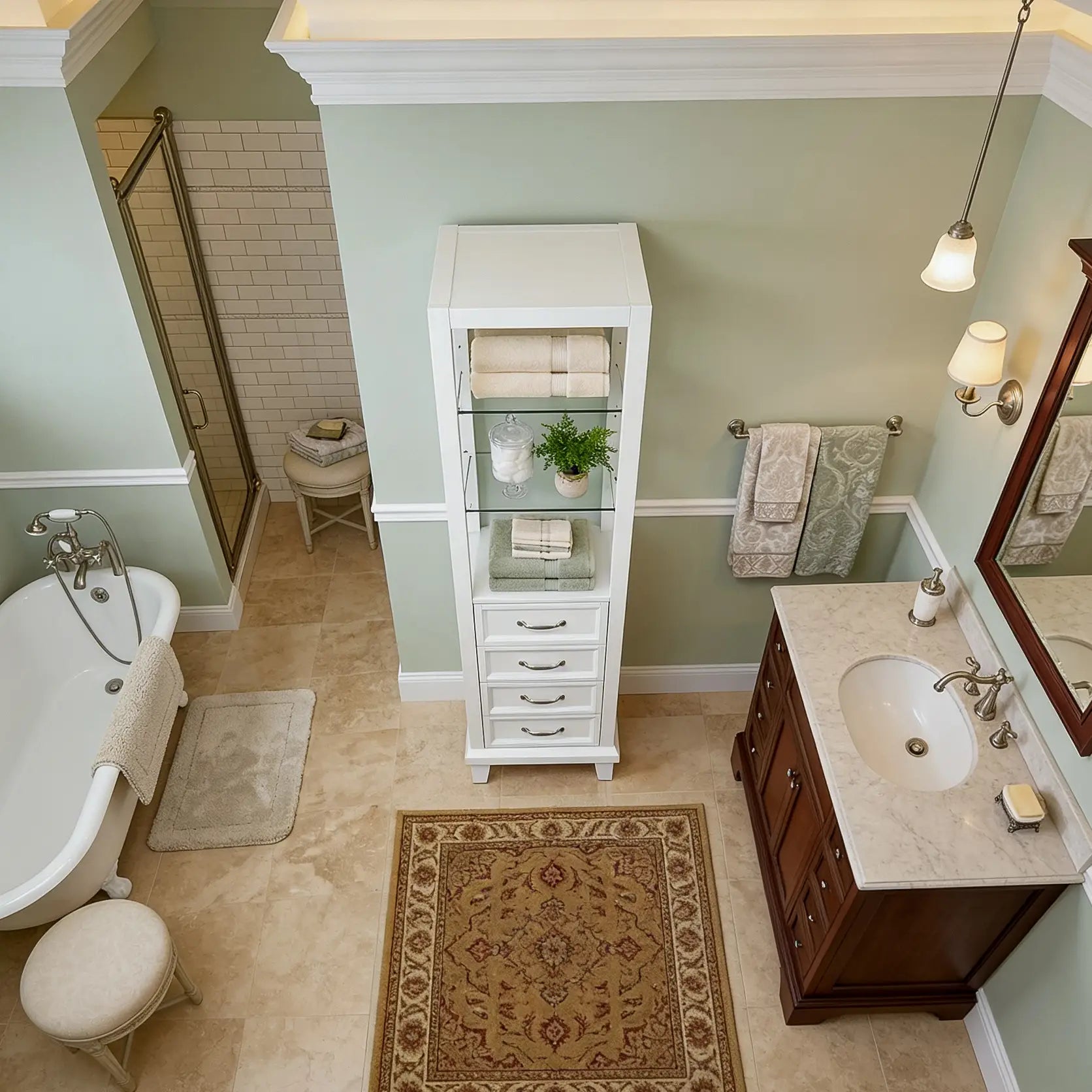 Bathroom with white cabinet, sink, and bathtub